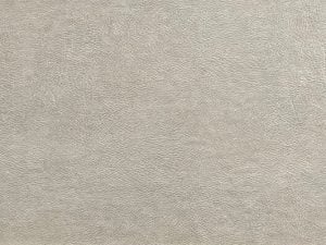beige wall tile with the close-up texture of real leather