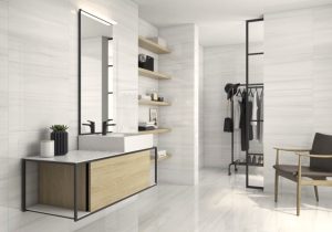 bathroom walls and floors with a 24x48 tile in of site color and subtle linear veins in warm tone