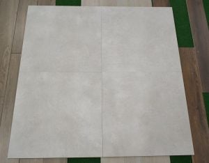 32x32 tile with the look of concrete floors in white color with some grey
