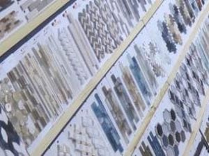Small, decorative glass, marble, slate, aluminum and ceramic tiles. For walls and floors.