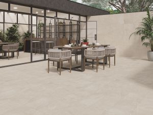 a light beige color porcelain tile that looks like stone flowing interior floors to exterior