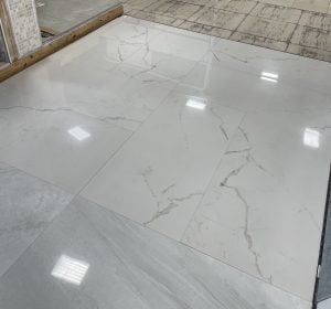 showroom floors with warm white marble look tile Santorini