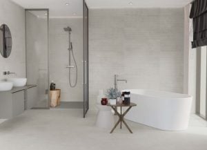 a bathroom floors and wall with concrete style tile in white color