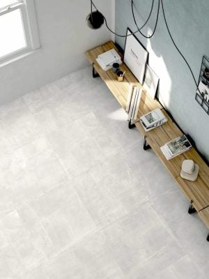 living room floors with light gray porcelain tile that looks like cement floors in a semi polished finish