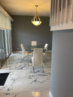 living room with white and blue porcelain tile that looks like marble