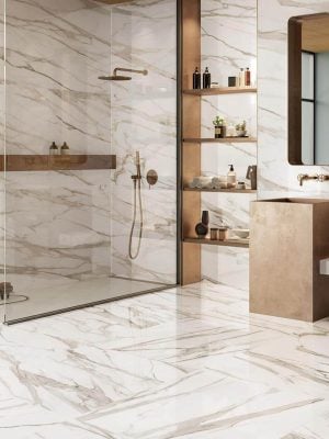 large bathroom floors and walls with a white marble look porcelain tile that has gray and brown color veining
